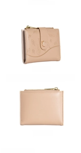 Detail view of beige bi-fold wallet featuring embossed leaf texture and zip coin pocket