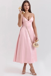 Detail of pink satin V-neck dress with natural pleats and elegant vintage drape