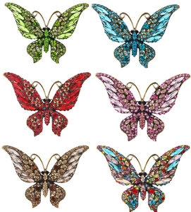 Set of six vintage butterfly brooches featuring colorful crystals and antique bronze finish