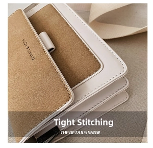 Close-up of contrast leather stitching and multi-layer accordion side on chic crossbody bag