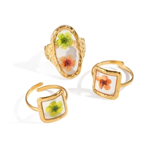 Three gold stainless steel adjustable rings with real yellow dried flower resin inserts