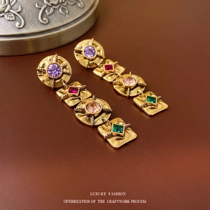 Vintage style drop earrings with colorful faceted gemstones on aged gold hammered metal