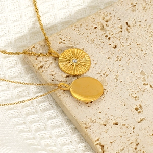 18K gold plated stainless steel layered necklace with sunburst and round coin pendants
