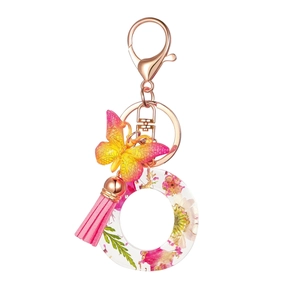 Floral resin letter O keychain with pink tassel and gradient butterfly charm in rose gold