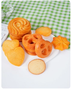 Macro view of realistic PVC cookies on a white plate with tea time background