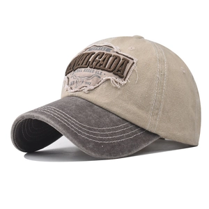 Close-up of vintage embroidered bull head patch and washed canvas texture on a baseball cap