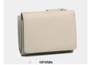 Close-up of off-white pebble leather texture on a high-quality tri-fold wallet