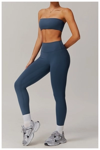 Close-up of high-waisted fitness leggings and sports bra set in dusty blue matte fabric