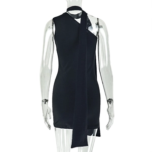 Detail of black mini dress featuring a halter neckline and long decorative ribbons on back