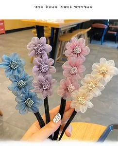Detail of Korean fabric flower hair twister set in Morandi blue, purple, pink and champagne