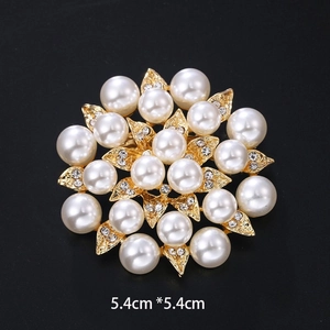 Detailed view of round flower brooch with white pearls and rhinestones 5.4cm x 5.4cm
