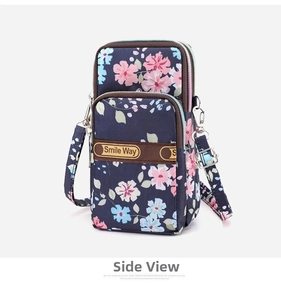 Detailed view of the three-zipper nylon mini bag with floral patterns and strap