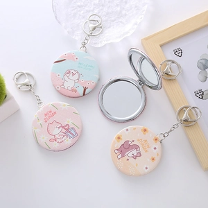 Portable mini folding makeup mirror with cute animal prints and metal keychain attachment