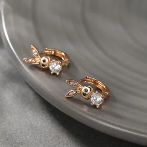 Rose gold bunny hoop earrings with white cubic zirconia and black zircon accents