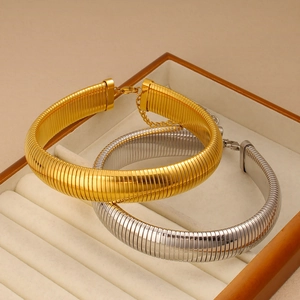 Detail of gold and silver flat omega chain necklaces with lobster clasp and extension chain