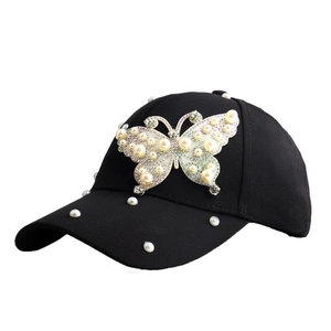 Black cotton baseball cap featuring pearl butterfly design and rhinestone accents