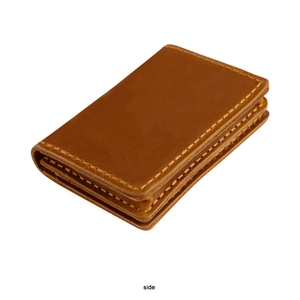 Side view of handmade crazy horse leather card holder showing thick stitching detail