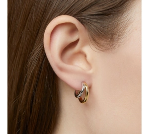 Detailed view of bicolor C-shape stainless steel earrings with gold and silver finish