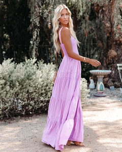 Detail of purple striped maxi dress with tiered skirt and smocked bodice in garden