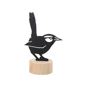Minimalist black bird silhouette iron ornament with a natural wooden base for home decor