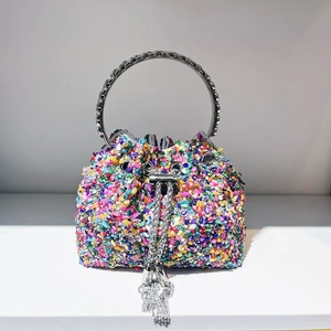 Detail of colorful rhinestone bucket bag with metal ring handle and tassel drawstring