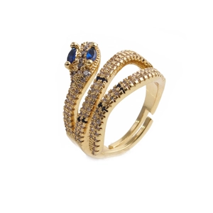 Detail of adjustable gold snake ring with white zircons and blue marquise eye gems