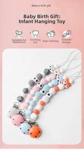 Detail of four handmade crochet fox and star silicone baby pacifier clips for newborns