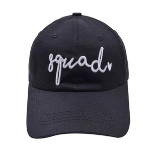 Detail of white squad embroidery with heart icon on black cotton baseball cap