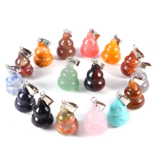 Natural jade and obsidian gourd pendants in assorted colors arranged in a circle