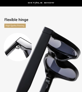 Detailed macro view of high-quality flexible metal hinge on black oval sunglasses