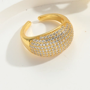 Detailed view of a gold-plated V-shaped adjustable ring with sparkling zircon pavé setting