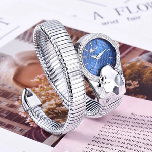 Detailed close-up of a silver snake-shaped bracelet watch with a blue dial and leopard head