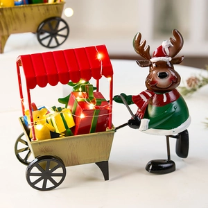 Christmas reindeer metal train ornament with warm LED lights on a festive background