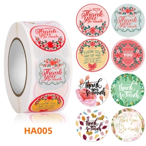 Close-up of circular floral thank you stickers showing eight unique botanical designs