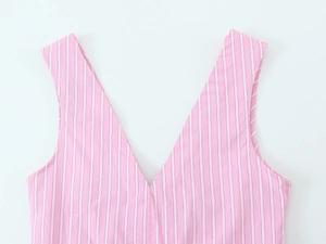 Detailed close-up of pink and white vertical stripes on a cotton V-neck camisole top