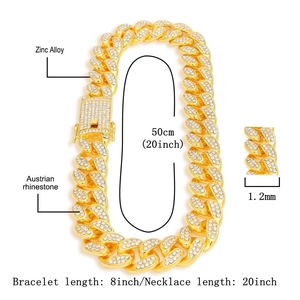 Macro shot of gold-plated iced-out Cuban link chain and bracelet with Austrian rhinestones