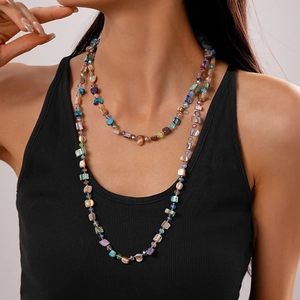 Close-up of bohemian double-layer necklace with colorful irregular faux shell beads