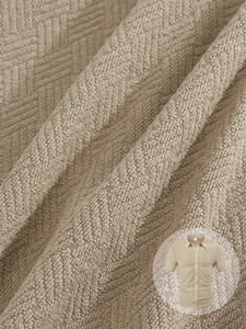 Macro shot of breathable waffle knit texture on a men's khaki short sleeve polo shirt