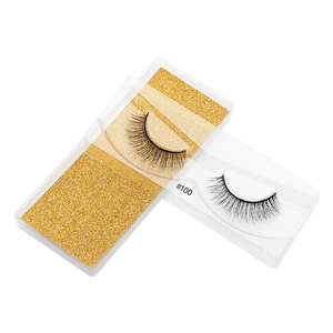 Detailed macro view of 3D faux mink eyelashes style #100 with glittery gold backing