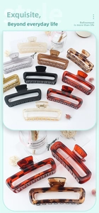 Detail of large rectangular hollow hair claws in various glossy and matte leopard patterns