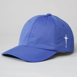 Detail of side white star embroidery on high-quality bright blue cotton baseball cap