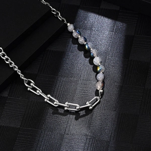 Titanium steel necklace with colorful natural stones and silver chain on black background