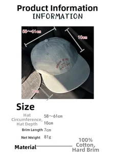 Detail of washed canvas baseball cap featuring white Dream Big letter embroidery