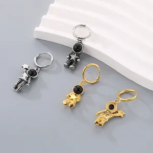 Asymmetric astronaut hoop earrings in gold and silver finish with black bead visor