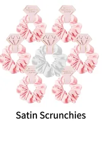 Set of 7 faux silk scrunchies in pink and white with elegant diamond-shaped packaging