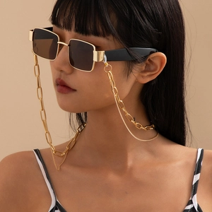 Hip hop style gold chunky chain necklace with black rectangle sunglasses on a model