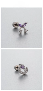 Macro detail of butterfly and moon titanium steel studs with purple cubic zirconia crystals