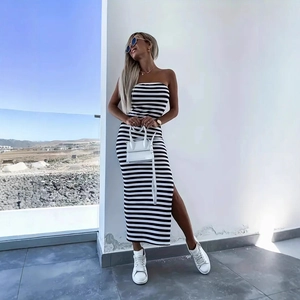 Detail of a slim fit black and white striped tube midi dress with a high side slit