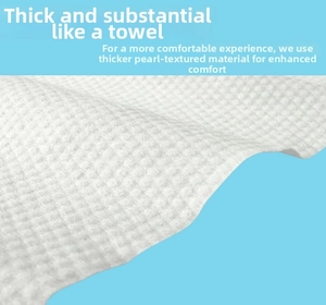 Close-up of thick disposable bath towel with white pearl texture on blue background