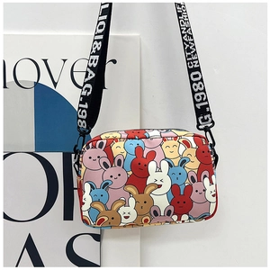 Detail of cute rabbit print crossbody bag with stylish wide letter patterned shoulder strap